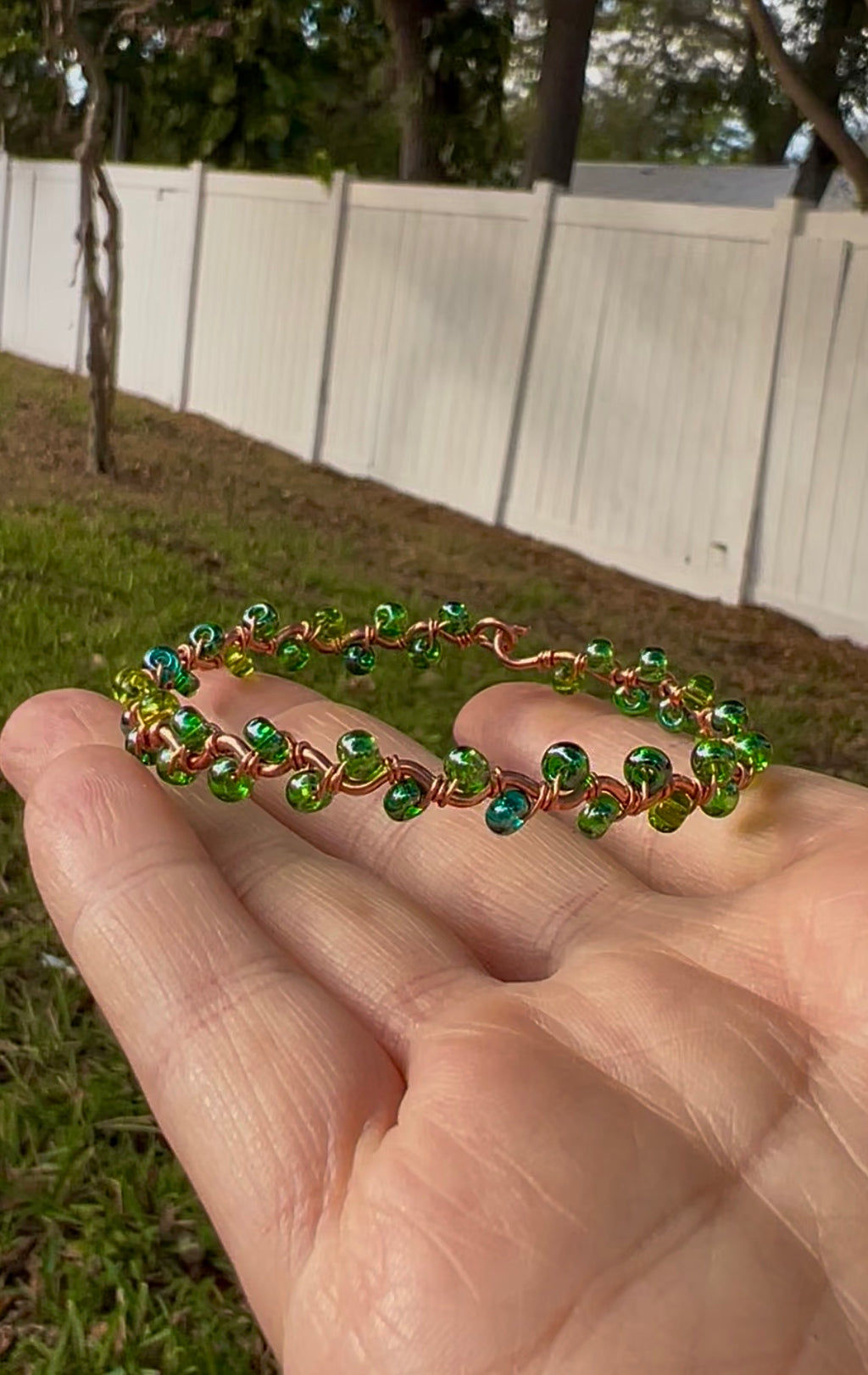 Copper bracelet with green beads